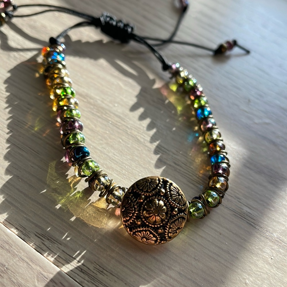 Multicolored goddess bracelet with vintage button